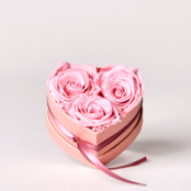 3 long-lasting light pink roses in a heart-shaped box