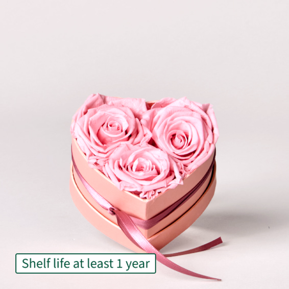 3 long-lasting light pink roses in a heart-shaped box