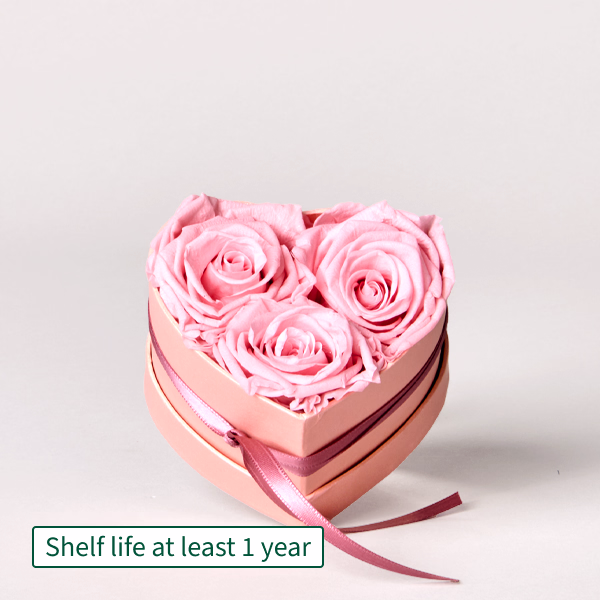 3 long-lasting light pink roses in a heart-shaped box